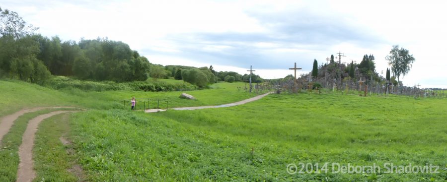 The backside of the Hill of the Crosses - a green field expanse.
