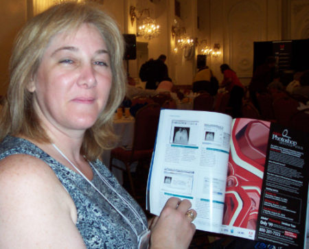 This was taken at Macworld Expo as I showed someone a photo I'd used in one of my Adobe GoLive columns in MacDesign.