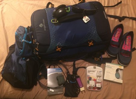 My Eagle Creek backpack, day pack, and a few tech things including Popticals sunglasses, Finsix charger, RadTech cables