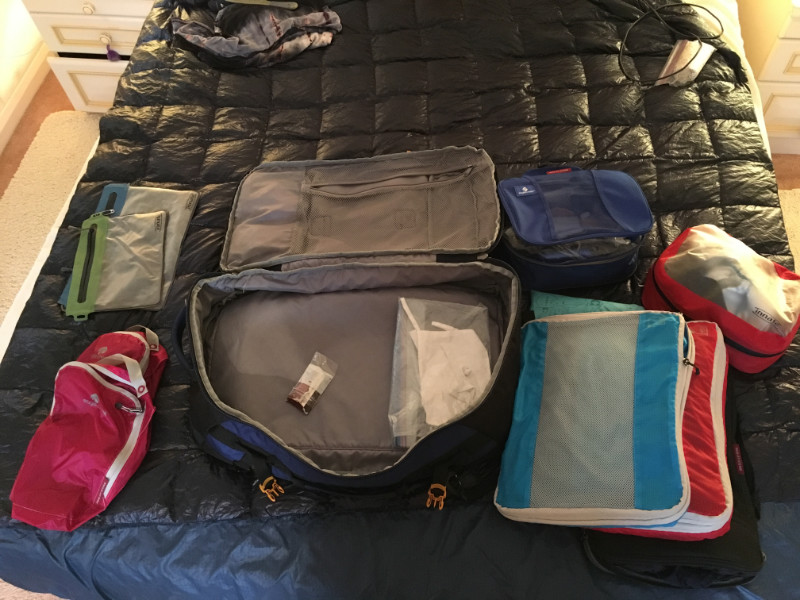My down travel blanket on the bed.