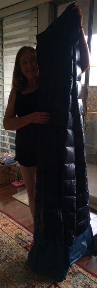 Me, holding up my down blanket so you can see how tall it is. Only you can't see how wide it is here.